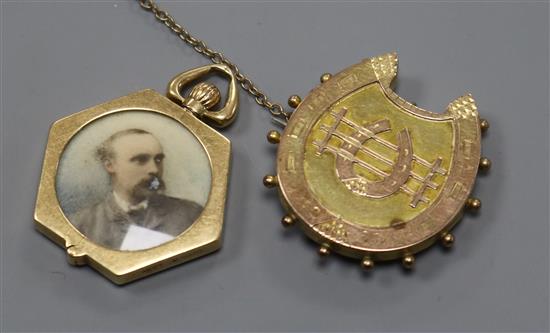 An early 20th century 15ct gold hexagonal portrait locket by M.B & Co, with hinged border and a 9ct gold brooch.
